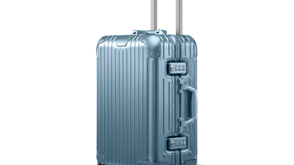 Rimowa s latest seasonal color brings an Arctic Blue tint to their aluminum luggage range Acquire