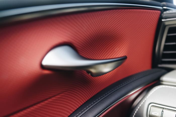 The brand's emotional design touches are expressed through elements like the interior's sculptural door handles.