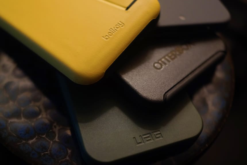 Bellroy Phone 3 Card Case (top left - $75), Caudabe Sheath (top right - $28), Otterbox Symmetry (center -$49), UAG Outback (bottom - $39)